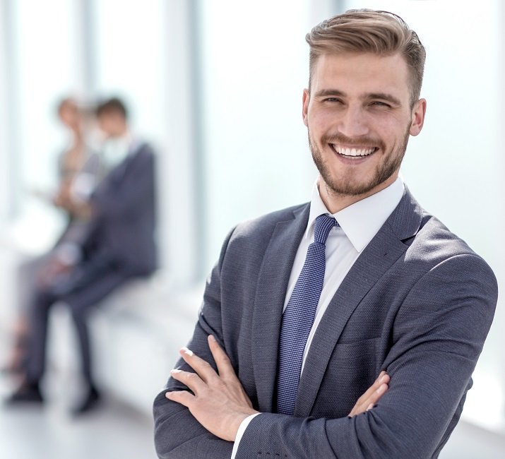 successful businessman on the background of a bright office.business people